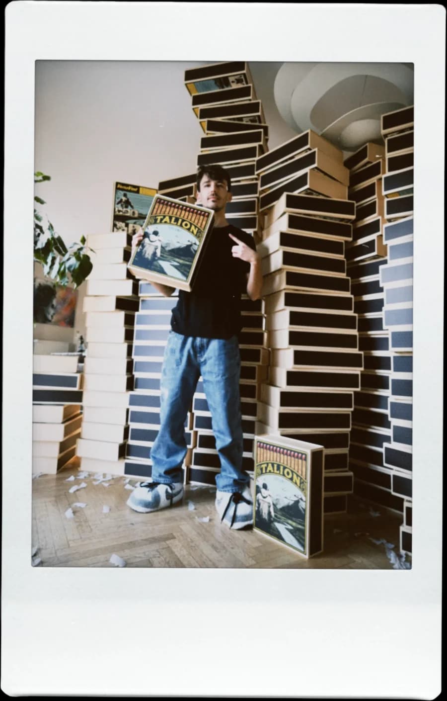 Hugo, founder of Talion Studio, surrounded by Talion boxes